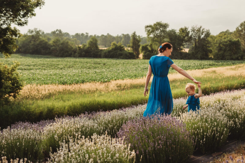 Mom and daughter twirling during a lavender family photography session