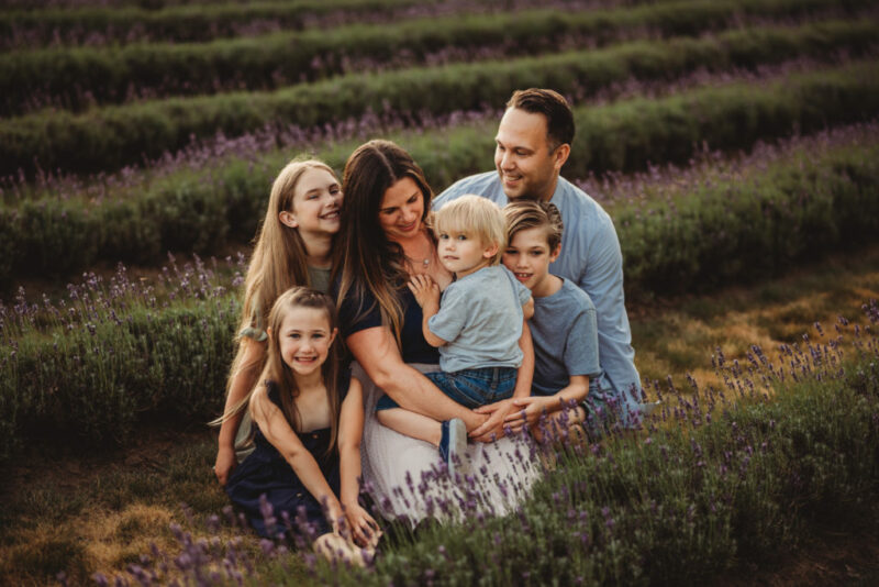 Family of five during a family photography session at laveanne lavender
