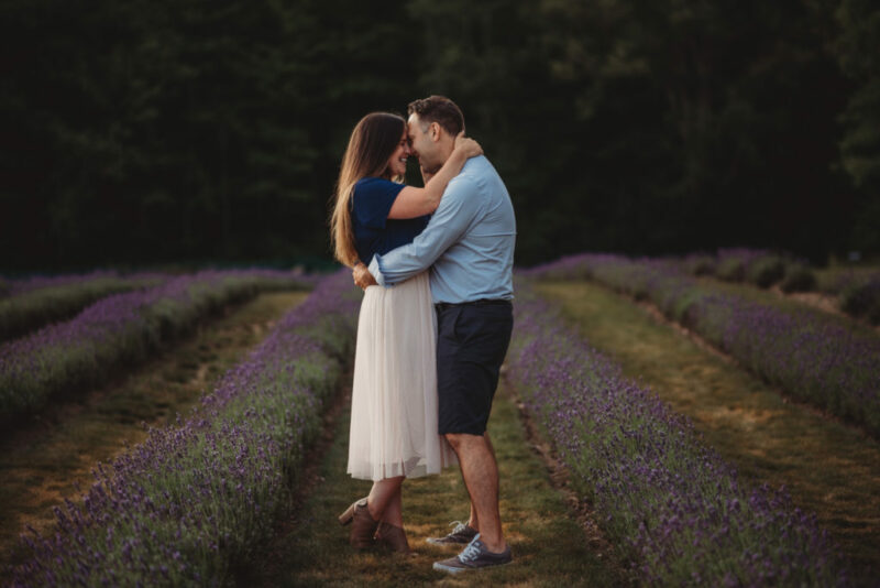 Couple embracing during a family photography session at Laveanne Lavender in Port Hope, Ontario