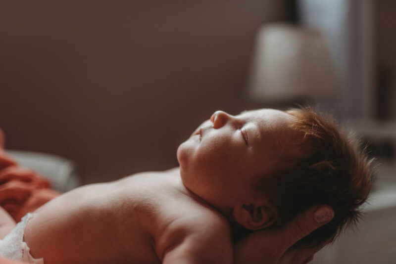 Close-up of a newborn's face during a lifestyle newborn session