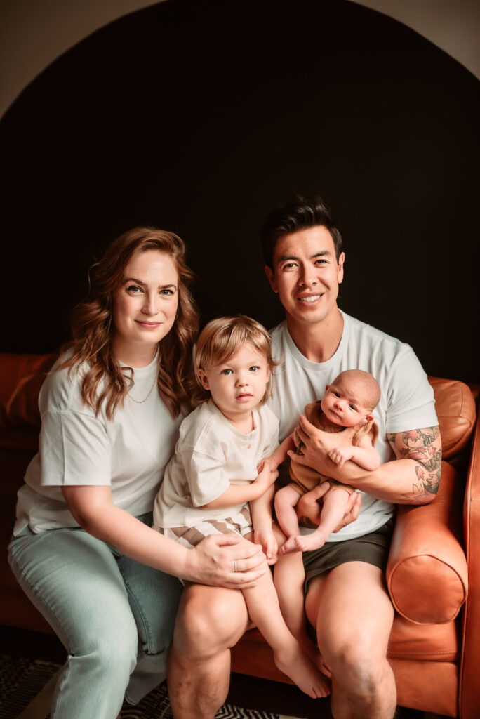 Family of four during an in-home newborn session