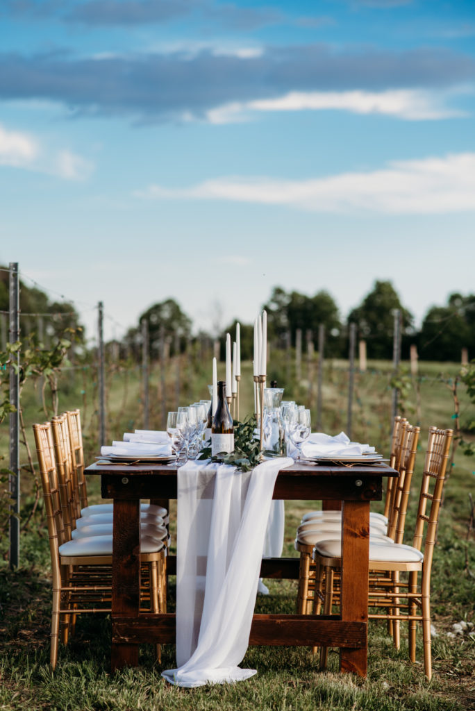 A table set up for an ontario vineyard wedding